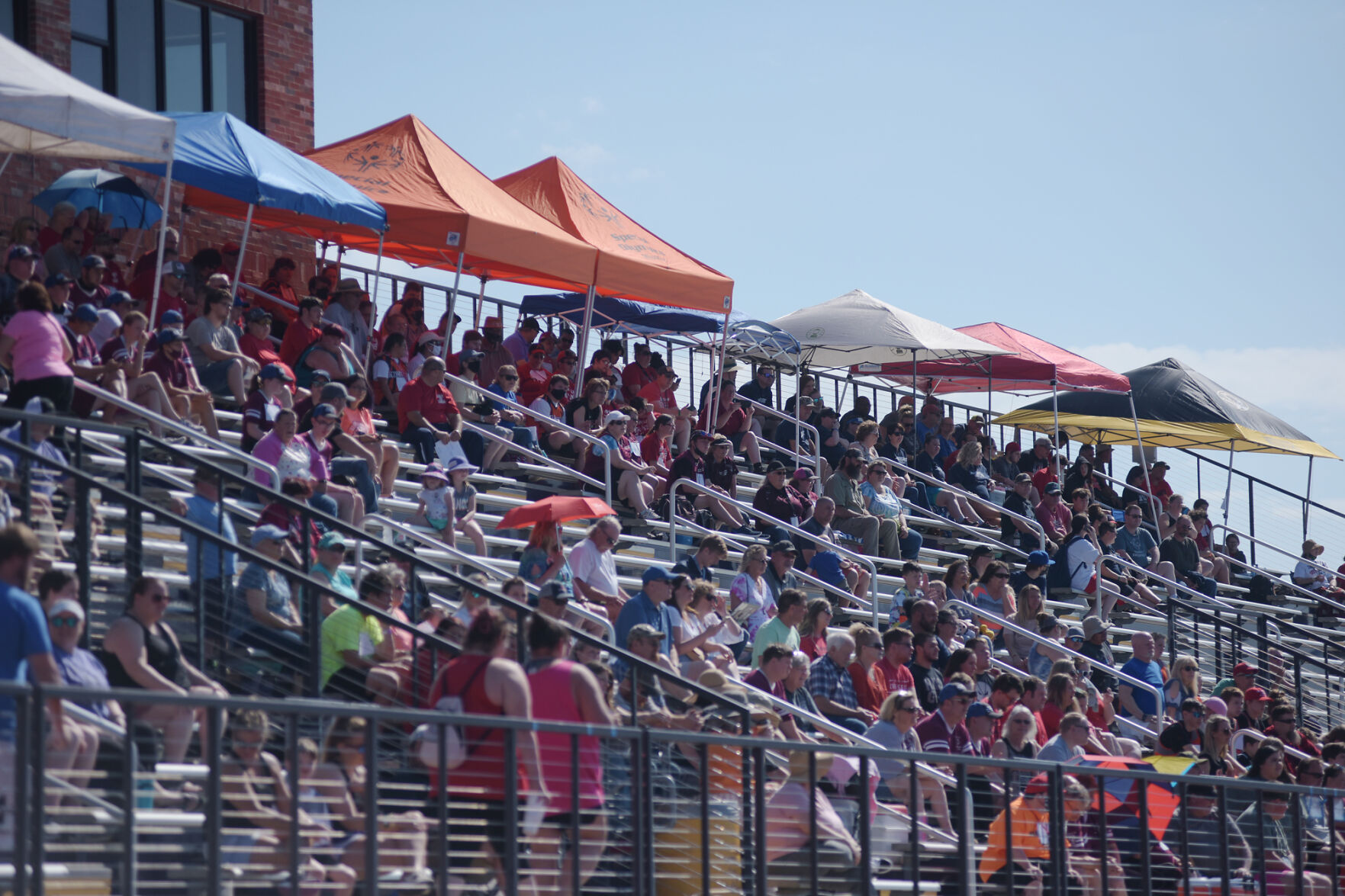 Family, friends and participants watch the events